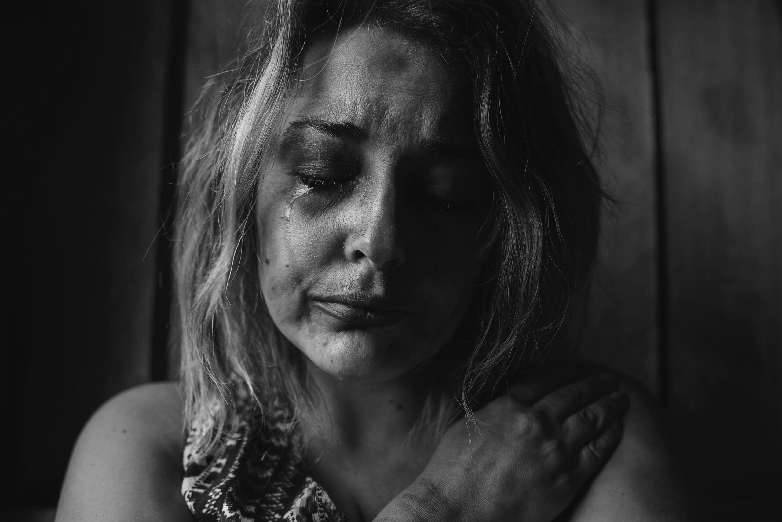 Black and White photo of woman crying
