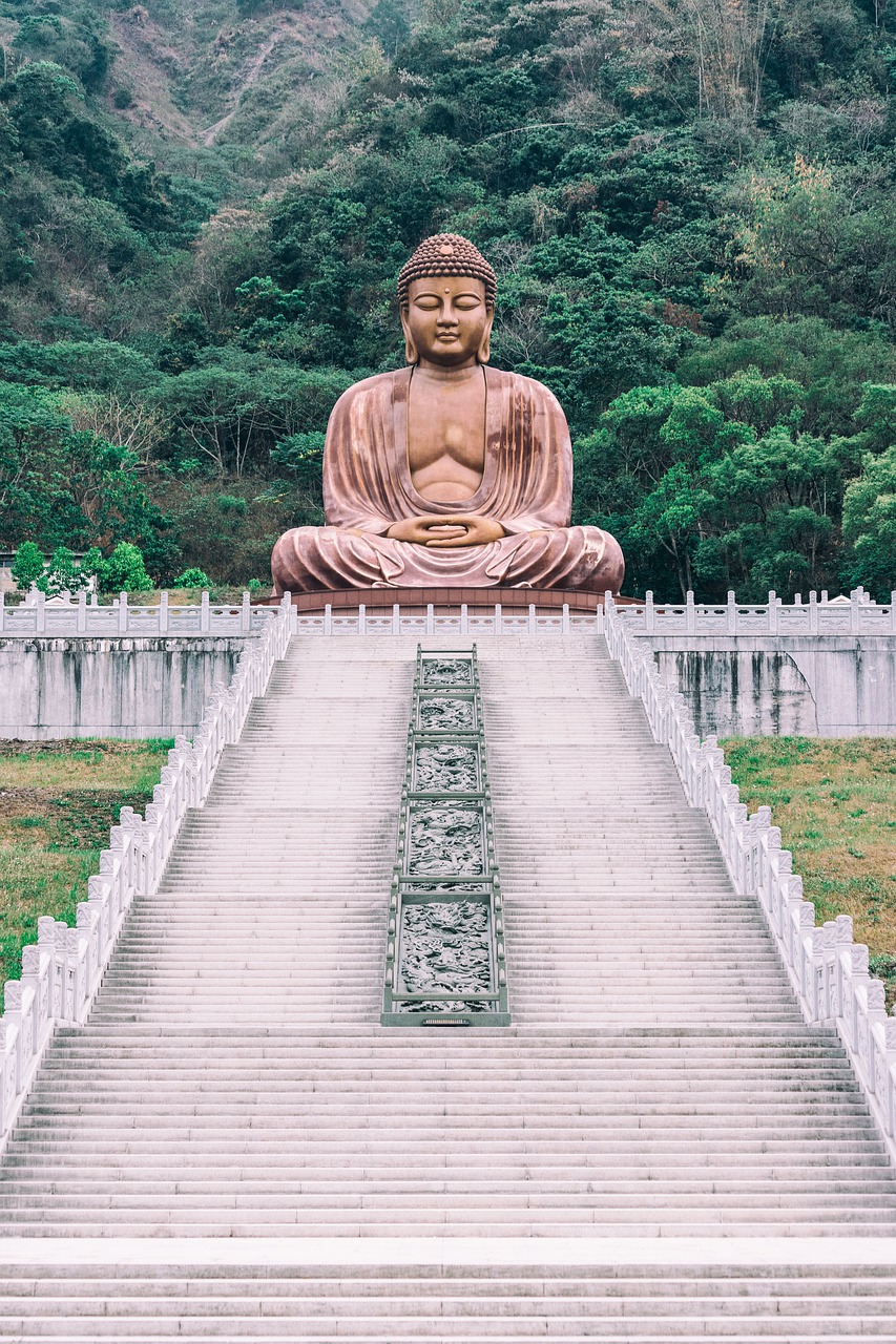 A monumental Buddha atop a long stairway