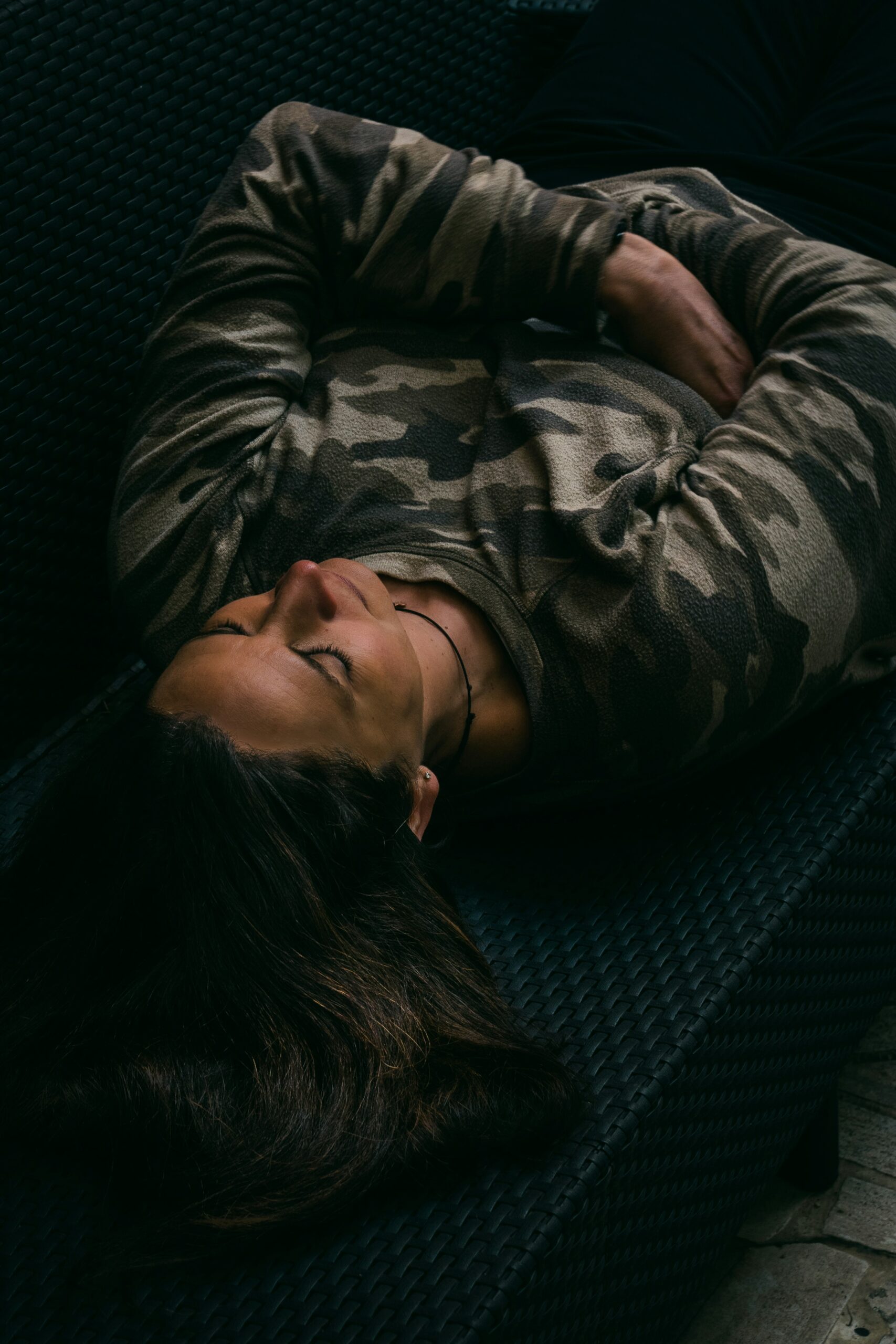 Man in fatigues lying in meditation